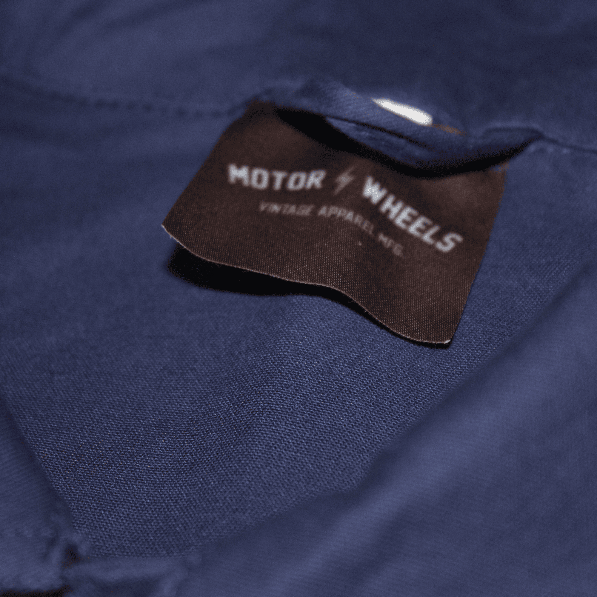 Veste de travail bleue "Dusty Ramblin’" Motor Wheels avec patch brodé, boutons-pression et style workwear vintage